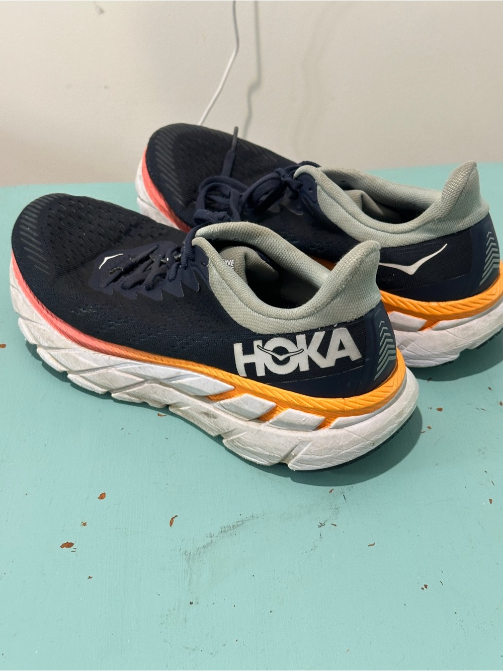 Hoka women’s Navy with Orange and Coral Accent Sneakers